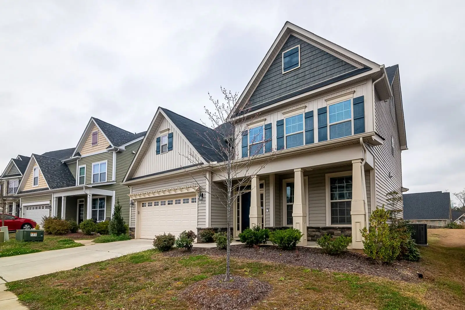 Two-story home with a covered front porch and asphalt shingle roof