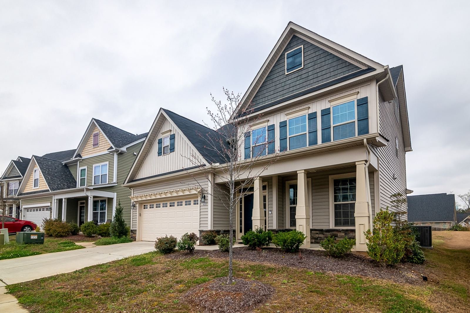 Two-story home with a covered front porch and asphalt shingle roof